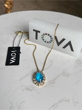 TOVA Bright Blue Crystal feminine stone surrounded by mini crystals.